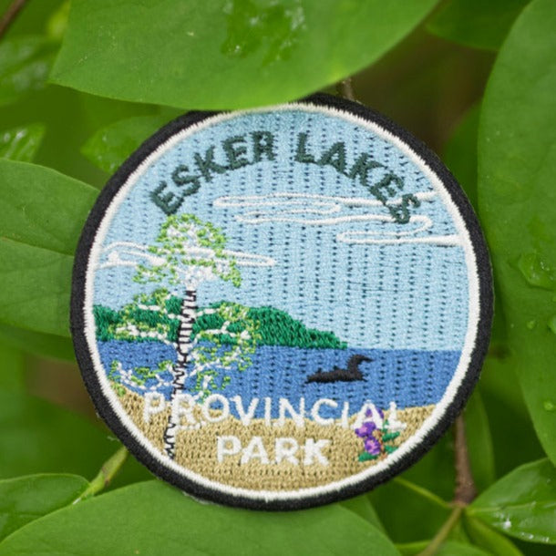 Round embroidered park crest patch for Esker Lakes Provincial Park