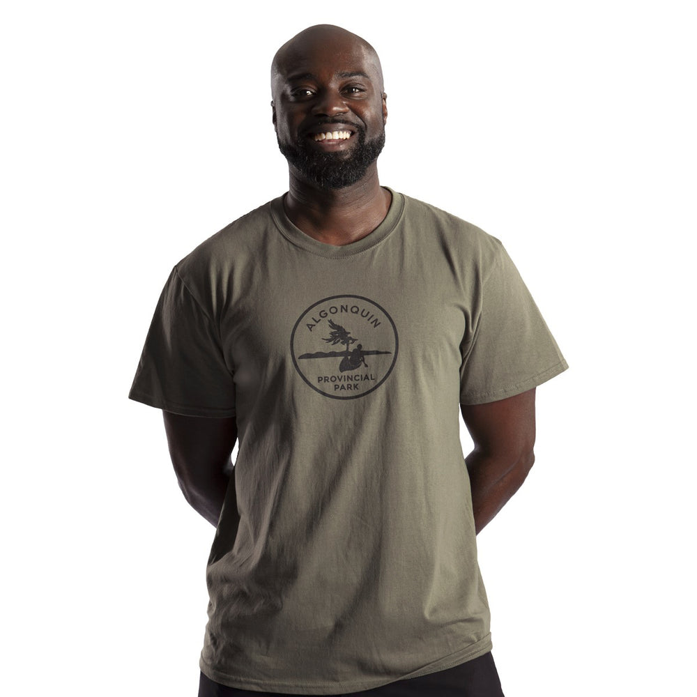 Male wearing Unisex Park Specific T-shirt (front). Black Algonquin park crest imprint on centre chest.