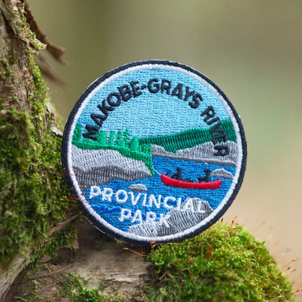 Round embroidered park crest patch for Makobe-Grays River Provincial Park