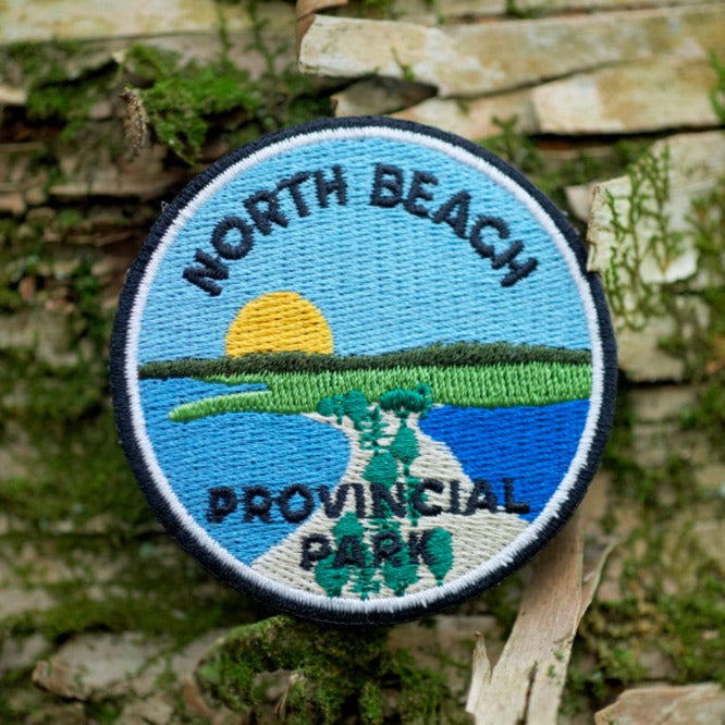 Round embroidered park crest patch for North Beach Provincial Park