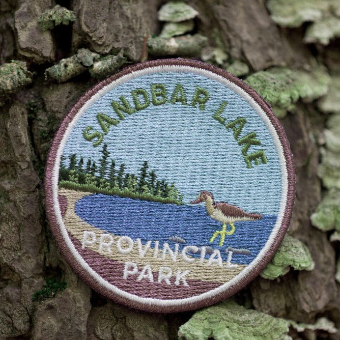 Round embroidered park crest patch for Sandbar Lake Provincial Park